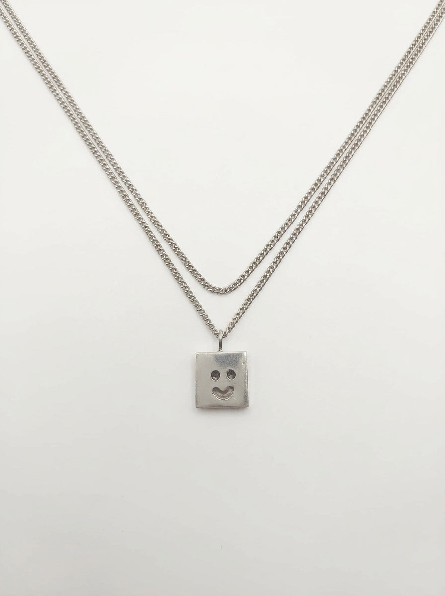 Fien Demuynck zilver juweel HAPPY-SAD ketting
